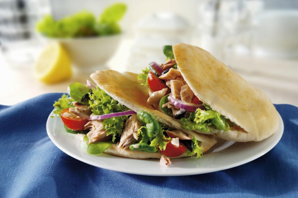 <p>Make a tuna pita with one mini whole-wheat pita, 2 ounces water-packed tuna, 1 tablespoon mayonnaise, mustard, cucumber and onion slices. Serve with 10 baby carrots and 2/3 cup plain, unsweetened Greek yogurt with a small pear.</p>