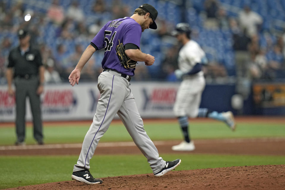 Colorado Rockies relief pitcher Matt Koch (54) walks back to the mound as Tampa Bay Rays' Josh Lowe runs around the bases after his two-run home run during the eighth inning of a baseball game Thursday, Aug. 24, 2023, in St. Petersburg, Fla. (AP Photo/Chris O'Meara)