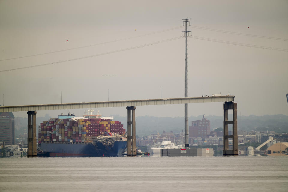 Tugboats escort the container ship Dali after it was refloated in Baltimore, Monday, May 20, 2024. The container ship that caused the deadly collapse of Baltimore's Francis Scott Key Bridge was refloated Monday and has begun slowly moving back to port. (AP Photo/Matt Rourke)