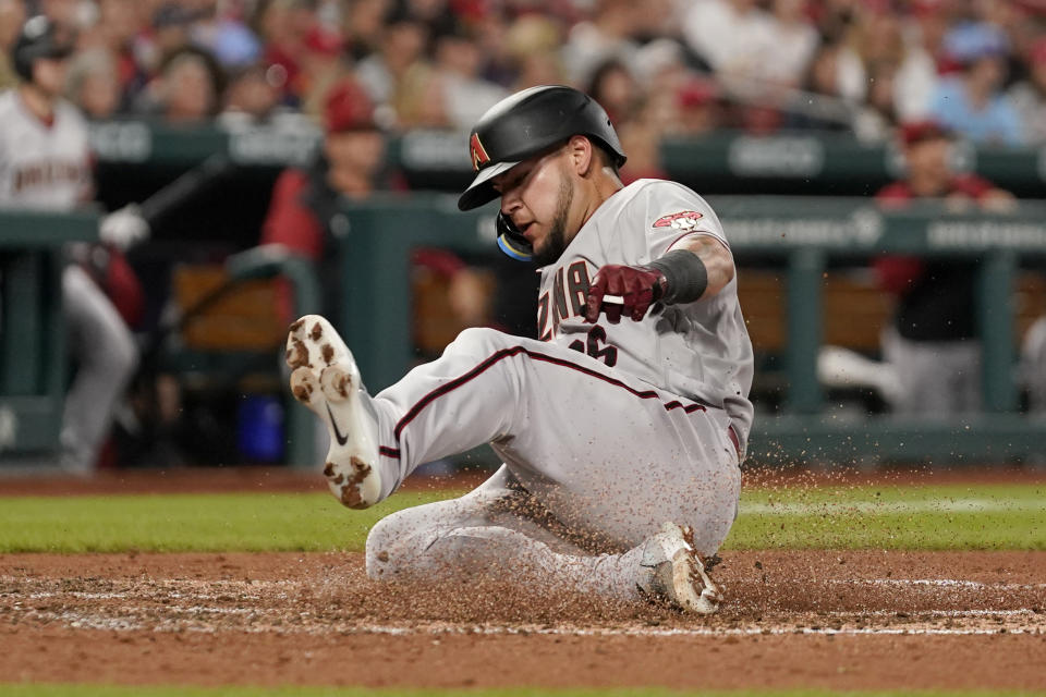 Arizona Diamondbacks' Jose Herrera scores during the third inning of a baseball game against the St. Louis Cardinals Friday, April 29, 2022, in St. Louis. (AP Photo/Jeff Roberson)