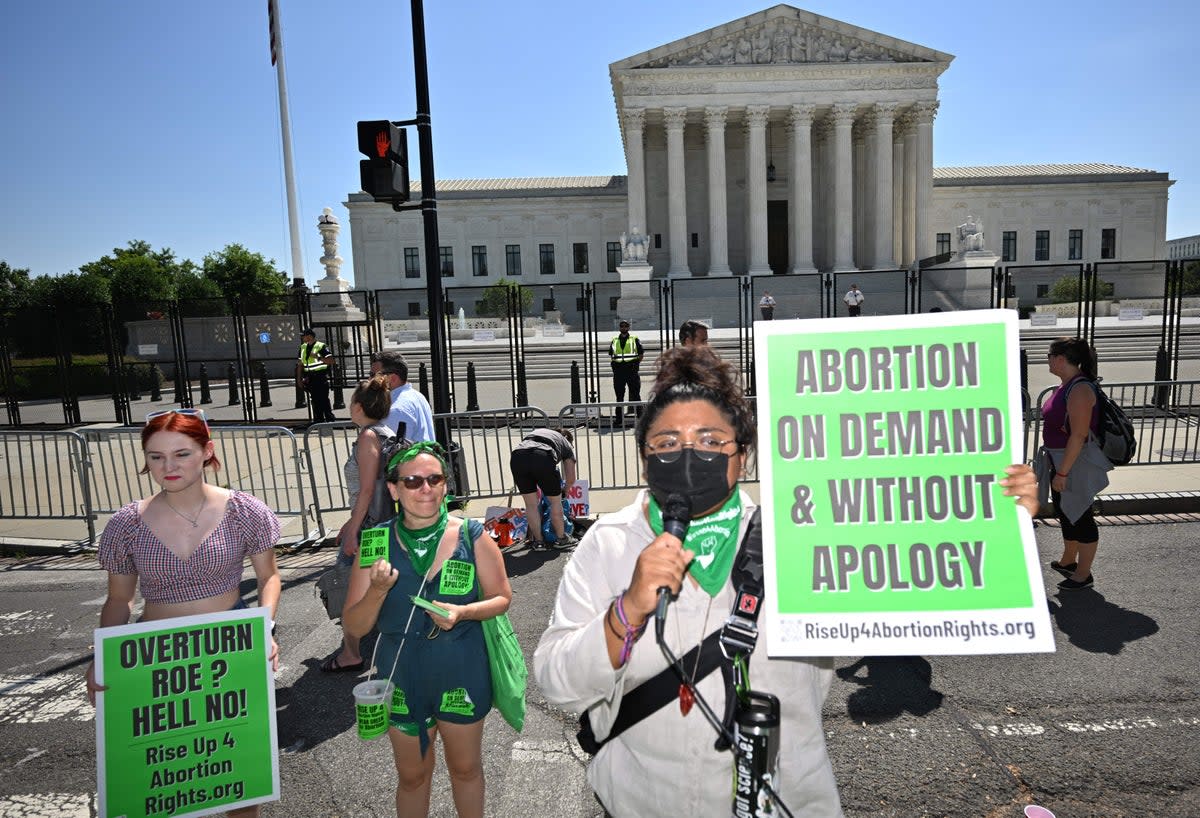 Pro-choice activists are seen outside of the US Supreme Court (AFP via Getty Images)