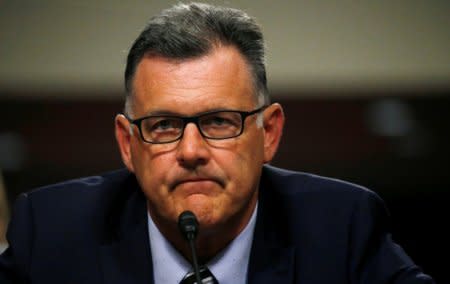 FILE PHOTO: Steve Penny, former president of USA Gymnastics invokes his 5th amendment right to not answer questions during the Senate Commerce, Science and Transportation Subcommittee in Washington, U.S., June 5, 2018. REUTERS/ Leah Millis/File Photo