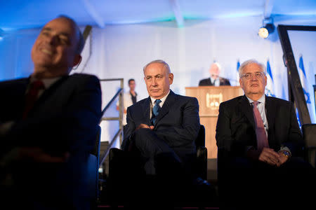 Israeli Prime Minister Benjamin Netanyahu (C) and David Friedman (R), the new United States Ambassador to Israel attend an event marking the 50th anniversary of Israel's capture of East Jerusalem during the 1967 Six-Day War, opposite the Old City wall and near the Tower of David in Jerusalem May 21, 2017. REUTERS/Abir Sultan/Pool