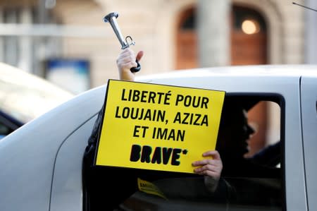 FILE PHOTO: Demonstrator from Amnesty International protests outside the Saudi Arabian Embassy on International Women's day in Paris