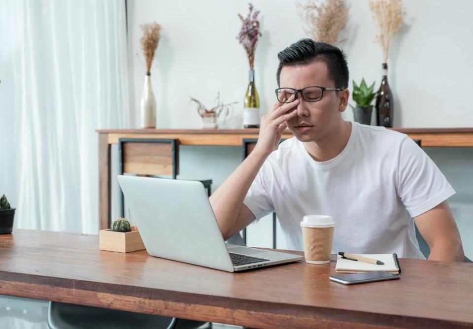 A man looks tired and stressed.