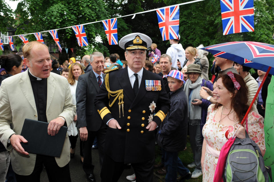 LONDON, ENGLAND - JUNE 03: Prince Andrew, Duke of York (C) attends the 'Big Jubilee Lunch' at All Saints Church in Fulham ahead of the Diamond Jubilee River Pageant on June 3, 2012 in London, England. For only the second time in its history the UK celebrates the Diamond Jubilee of a monarch. Her Majesty Queen Elizabeth II celebrates the 60th anniversary of her ascension to the throne. Thousands of well-wishers from around the world have flocked to London to witness the spectacle of the weekend's celebrations. The Queen along with all members of the royal family will participate in a River Pageant with a flotilla of a 1,000 boats accompanying them down The Thames. (Photo by Matt Grayson - WPA Pool/Getty Images)