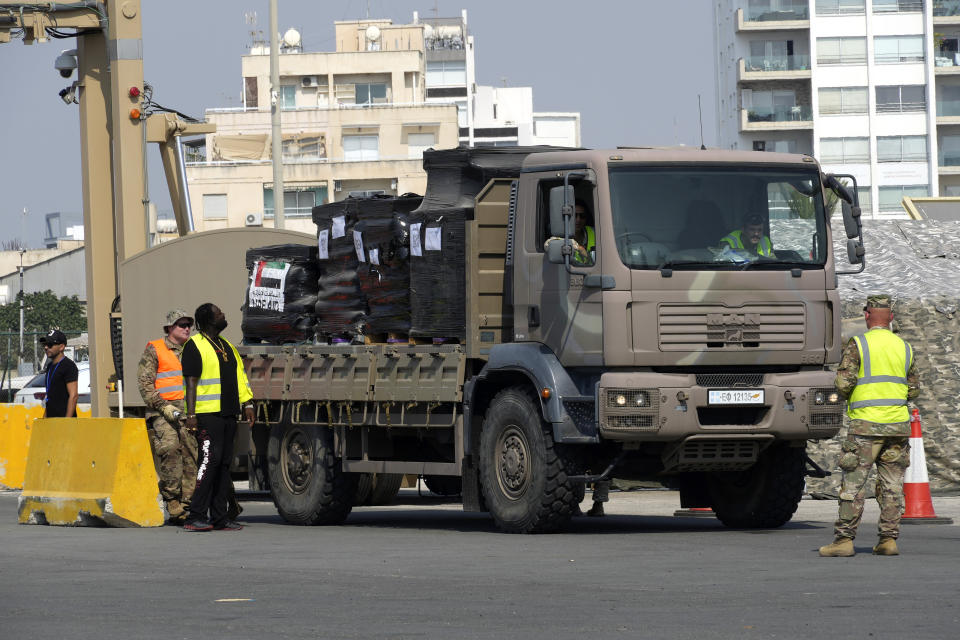 A truck carrying Gaza aid is about to enter a U.S ship, at the port of Larnaca, Cyprus, Wednesday, June 26, 2024. An official with the U.S. humanitarian assistance agency USAID says thousands of tons of food, medicines and other aid piled up on a Gaza beach isn't reaching those in need because of a dire security situation on the ground where truck drivers are either getting caught in the crossfire or have their cargo seized by "gang-like" groups. (AP Photo/Petros Karadjias)