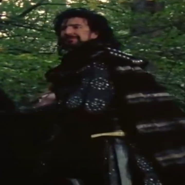 Alan Rickman as the Sheriff of Nottingham wearing leather studded armor in Robin Hood: Prince of Thieves