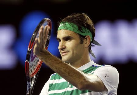 Switzerland's Roger Federer celebrates after winning his fourth round match against Belgium's David Goffin at the Australian Open tennis tournament at Melbourne Park, Australia, January 24, 2016. REUTERS/Brandon Malone