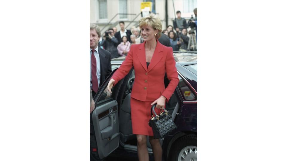  Princesse Diana teamed her red suit with her Lady Dior bag in 1996