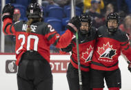 Canada's Renata Fast, right, celebrates her goal over Czechia with teammates during the second period of a hockey match at the IIHF Women's World Championships in Utica, N.Y., Sunday, April 7, 2024.(Christinne Muschi/The Canadian Press via AP)