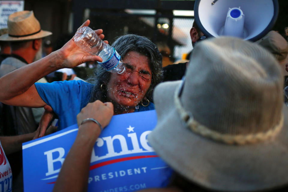 <p>A supporter of Senator Bernie Sanders clears her eyes with water after she said she was hit with pepper spray at the perimeter walls of the 2016 Democratic National Convention in Philadelphia, Pennsylvania, July 26, 2016.(Photo: Adrees Latif/Reuters)</p>