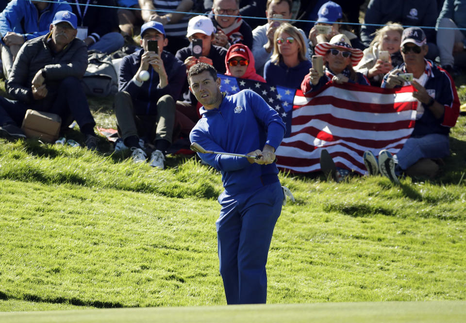 Europe's Rory McIlroy chips to the 8th green during a singles match on the final day of the 42nd Ryder Cup at Le Golf National in Saint-Quentin-en-Yvelines, outside Paris, France, Sunday, Sept. 30, 2018. (AP Photo/Matt Dunham)