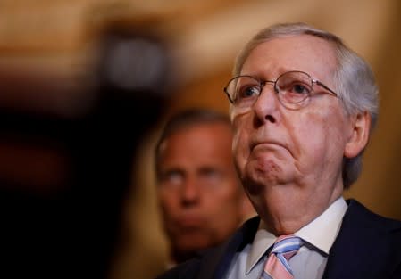 FILE PHOTO: U.S. Senate Majority Leader Mitch McConnell (R-KY) addresses reporters after the weekly senate party caucus luncheons at the U.S. Capitol in Washington