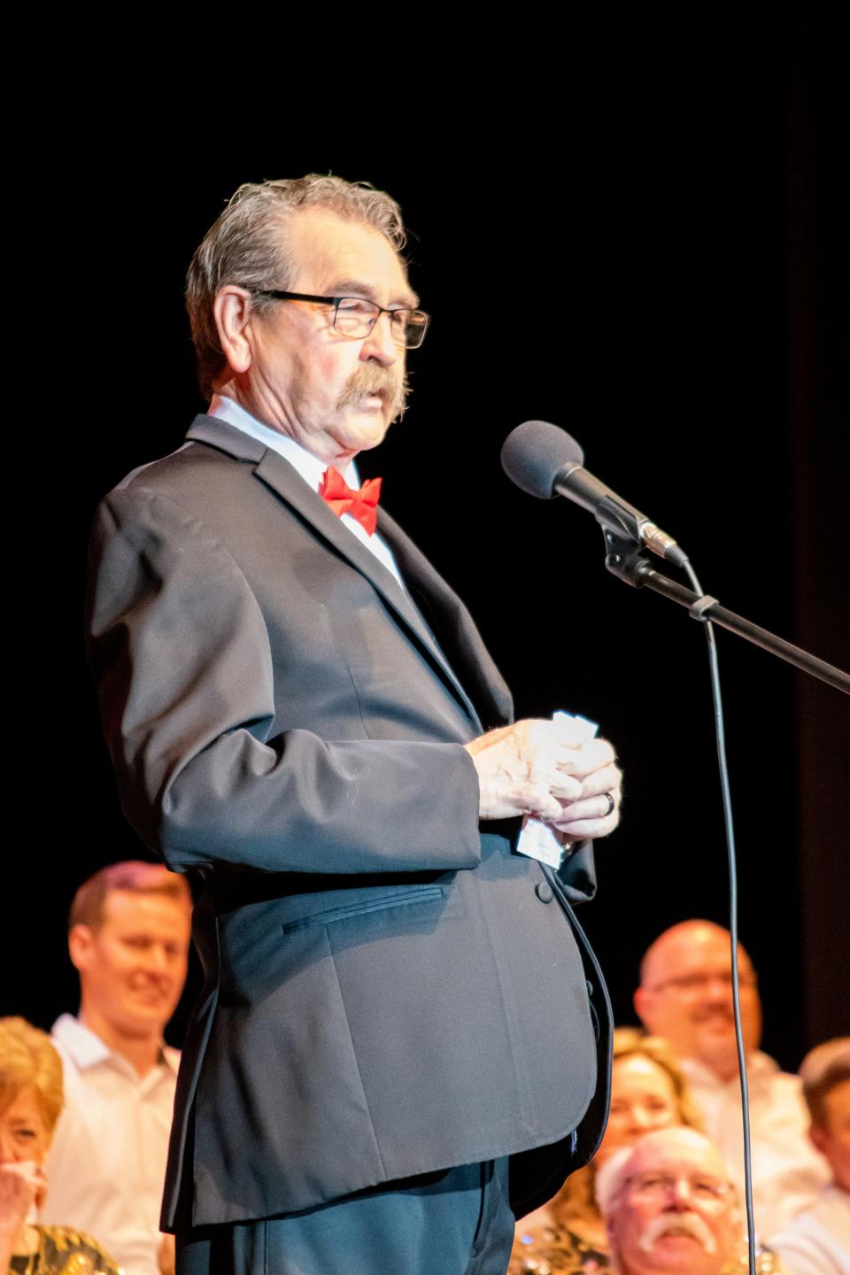 Mike Carpenter addresses the crowd at the 50th anniversary Music and Comedy Show at the Pritchard Laughlin Civic Center.