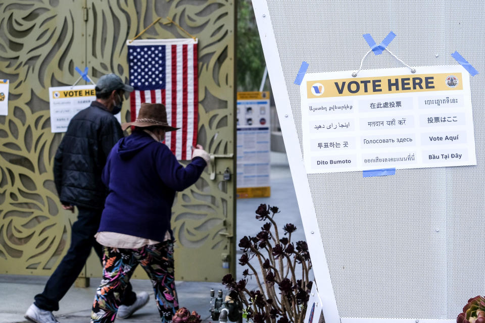 Voters arrive to cast their ballots at the Lincoln Park Senior Center in Los Angeles, Tuesday, Sept. 14, 2021. The recall election that could remove California Democratic Gov. Gavin Newsom is coming to an end. Voting concludes Tuesday in the rare, late-summer election that has emerged as a national battlefront on issues from COVID-19 restrictions to climate change. (AP Photo/Ringo H.W. Chiu)