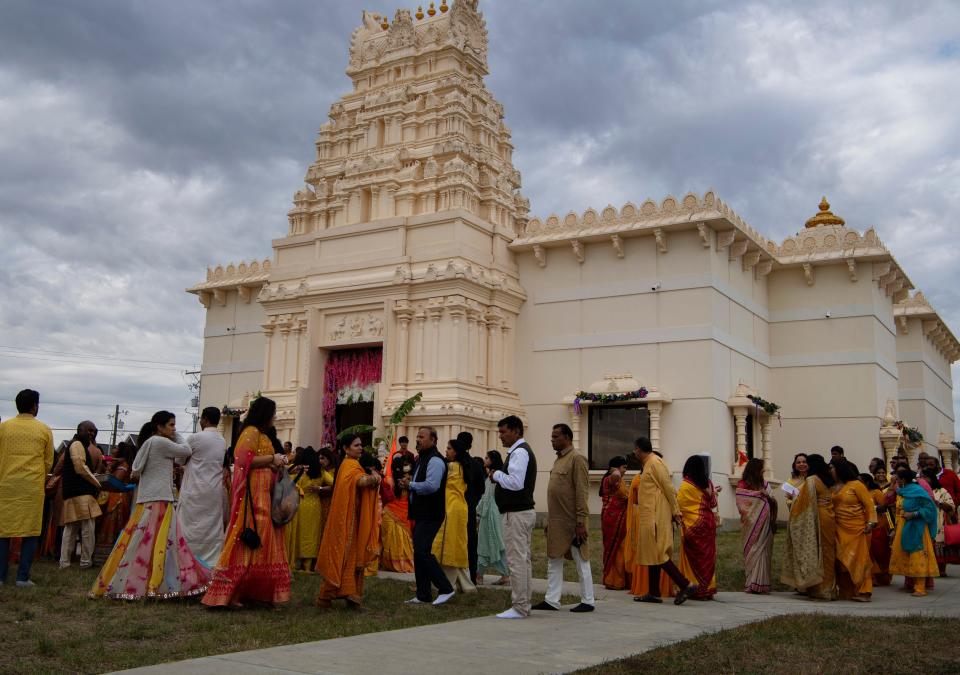 Worshipers gather at the Tri-State Hindu Temple in Newburgh, Ind., Sunday morning, Oct. 16, 2022. It was the  final day of the temple inauguration and the Prana Pratishtha festival.