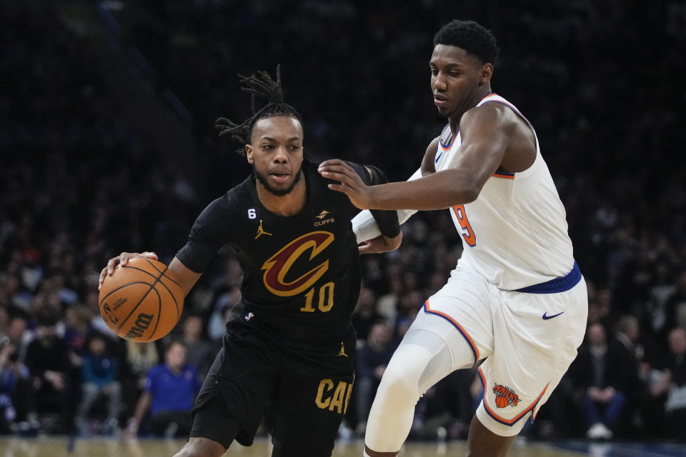 New York Knicks' RJ Barrett, right, defends Cleveland Cavaliers' Darius Garland during the first half of an NBA basketball game Tuesday, Jan. 24, 2023, in New York. (AP Photo/Frank Franklin II)