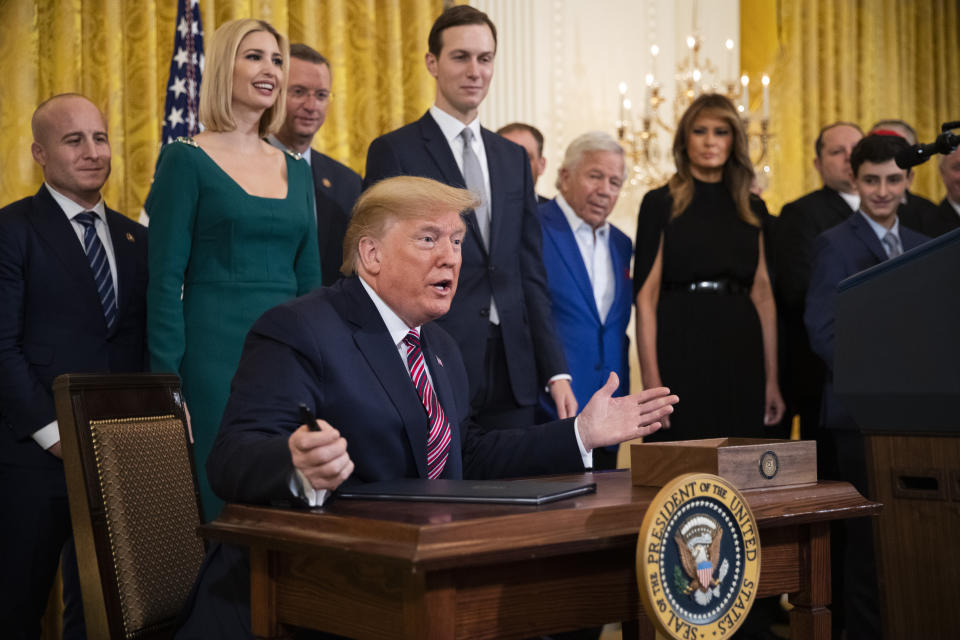 President Donald Trump gestures before signing an executive order targeting what his administration says is growing anti-Semitism on U.S. college campuses during a Hanukkah reception in the East Room of the White House in Washington on Wednesday, Dec. 11, 2019. (AP Photo/Manuel Balce Ceneta)