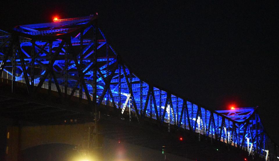 The Braga Bridge is lit in "Braga blue" lights Tuesday in Fall River.