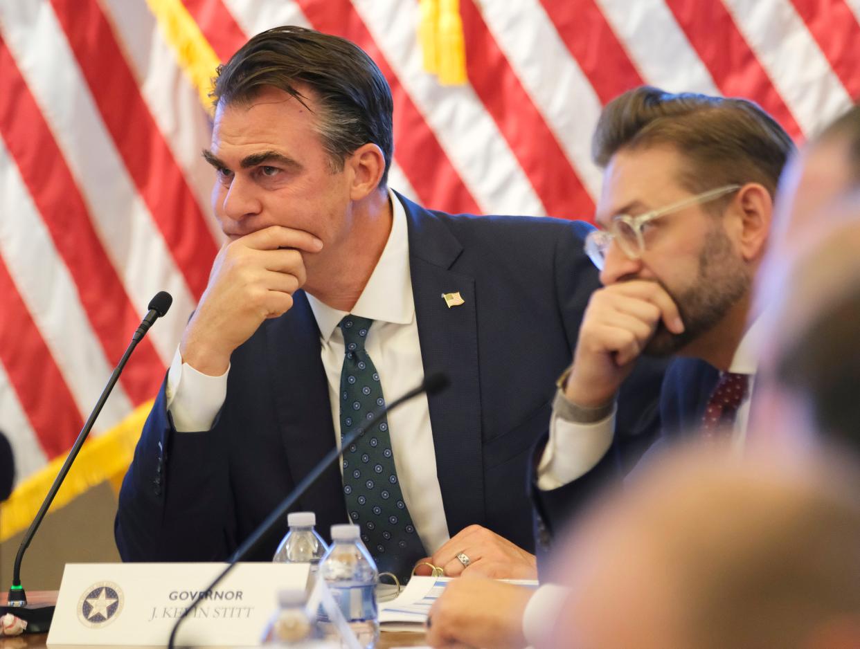 Gov. Kevin Stitt listens to Senate President Pro Tem Greg Treat in May during the governor's budget conference with the Senate and House leaders at the Oklahoma Capitol.