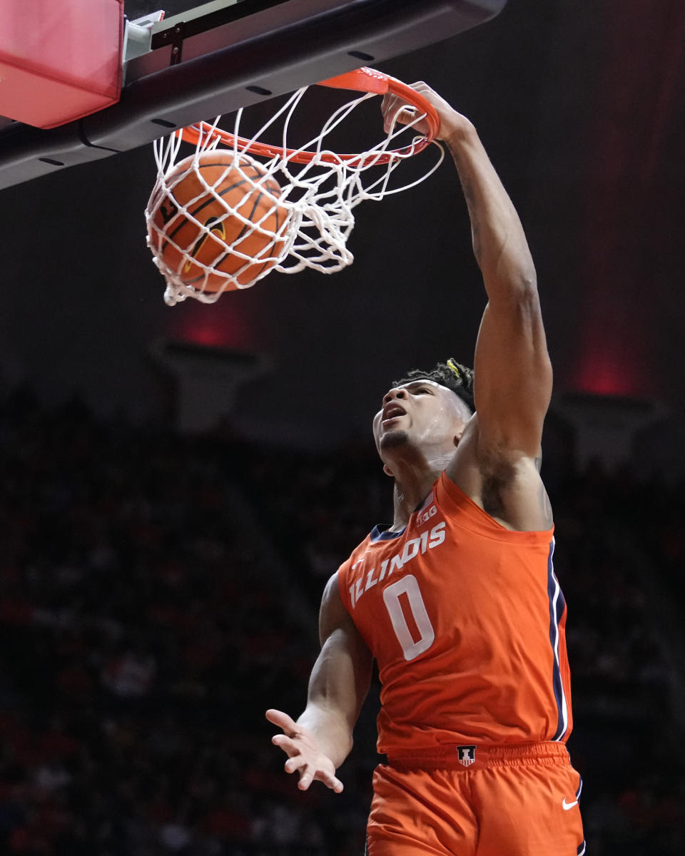 Illinois' Terrence Shannon Jr. dunks during the first half of the team's NCAA college basketball game against Marquette on Tuesday, Nov. 14, 2023, in Champaign, Ill. (AP Photo/Charles Rex Arbogast)