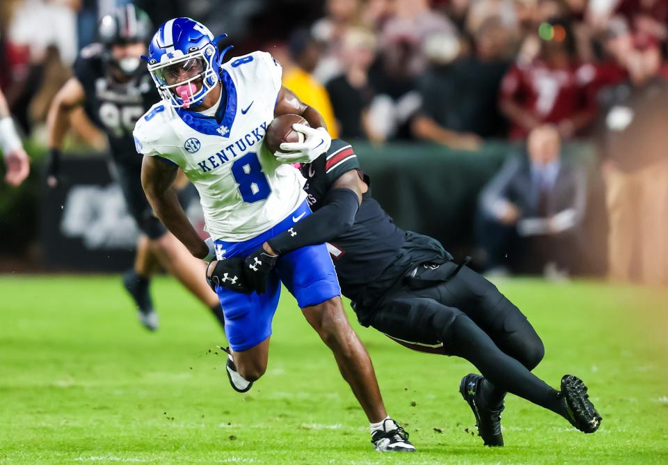 Nov 18, 2023; Columbia, South Carolina, USA; Kentucky Wildcats tight end Izayah Cummings (8) is brought down by South Carolina Gamecocks defensive back DQ Smith (1) in the first quarter at Williams-Brice Stadium. Mandatory Credit: Jeff Blake-USA TODAY Sports Kentucky