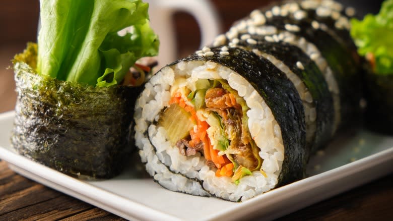 Close-up of rolled and cut kimbap on a plate