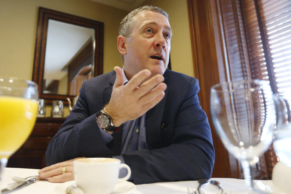 In this Nov. 19, 2019, photo James Bullard, president of the St. Louis Federal Reserve Bank, gestures during an interview in Richmond, Va. (AP Photo/Steve Helber)