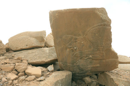 Remains of wall panels and colossal statues of winged bulls, destroyed by Islamic State militants are seen in the Assyrian city of Nimrud eastern bank of the Tigris River, south of Mosul, Iraq, November 16, 2016. REUTERS/Ari Jalal