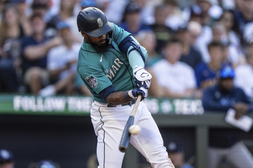 Seattle Mariners' Teoscar Hernandez hits a two-run double off Tampa Bay Rays relief pitcher Jalen Beeks during the seventh inning of a baseball game, Saturday, July 1, 2023, in Seattle. (AP Photo/Stephen Brashear)