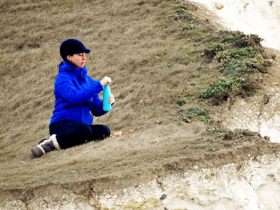 The woman seemed unworried by her precarious position (Sid Saunders / SWNS.com)