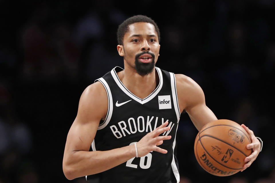 FILE - In this March 4, 2020, file photo, Brooklyn Nets guard Spencer Dinwiddie (26) is shown during the first quarter of an NBA basketball game in New York. Dinwiddie won’t take part in the restart of the NBA season. Dinwiddie announced that he is still testing positive for coronavirus and won't participate.(AP Photo/Kathy Willens, FIle)