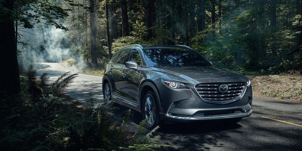 <p><strong>Mazda</strong></p><p>mazdausa.com</p><p><strong>$34160.00</strong></p><p><a href="https://www.mazdausa.com/vehicles/2021-cx-9" rel="nofollow noopener" target="_blank" data-ylk="slk:Shop Now" class="link ">Shop Now</a></p><p>The 2022 Mazda CX-9 midsize crossover carries a reasonable price tag, given that its interior materials are more akin to what you'd find in a true luxury three-row SUV. In test drives, our experts were impressed by its<strong> fun and sporty drive quality, as well as its sleek and sculptured exterior </strong>that proves SUVs don't have to be chunky or boxy. </p><p>Inside the cabin, you'll find an easy-to-read 10.3" display, Wi-Fi, Apple CarPlay/Android Auto smartphone integration and Bluetooth streaming. We found the first- and second-row seats to be comfy, but the snug third row is more suitable for kids than adults. If you typically travel with a lot of cargo in addition to humans, you might find yourself wishing for more space when all seven seats are in use. Higher-price trims include a second-row captain’s seating configuration, which definitely makes for more “ahh, so comfortable!” travel, but reduces maximum headcount to six.<br><br><strong>GOOD TO KNOW:</strong> Mazda is expected to launch a slightly larger <a href="https://www.caranddriver.com/mazda/cx-90" rel="nofollow noopener" target="_blank" data-ylk="slk:CX-90 model for 2023" class="link ">CX-90 model for 2023</a>, which should bring a more advanced suspension and a platform layout optimized for additional interior space. </p>