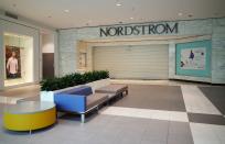 A shuttered entrance to the Nordstrom department store is seen in the Pentagon City Mall in Arlington, Virginia on March 17, 2020. - The coronavirus outbreak has transformed the US virtually overnight from a place of boundless consumerism to one suddenly constrained by nesting and social distancing.The crisis tests all retailers, leading to temporary store closures at companies like Apple and Nike, manic buying of food staples at supermarkets and big-box stores like Walmart even as many stores remain open for business -- albeit in a weirdly anemic consumer environment. (Photo by MANDEL NGAN / AFP) (Photo by MANDEL NGAN/AFP via Getty Images)