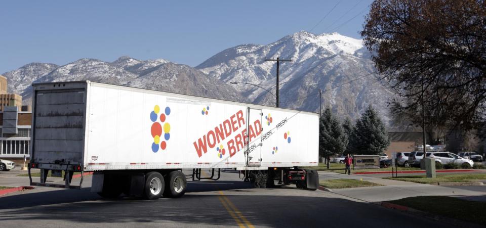 A Hostess Wonder Bread truck is shown in front of the Utah Hostess plant in Ogden, Utah, Thursday, Nov. 15, 2012. Hostess Brands Inc. is warning striking employees that it will move to liquidate the company if plant operations don't return to normal levels by Thursday evening. The maker of Twinkies, Ding Dongs and Wonder Bread said Thursday it will file a motion in U.S. Bankruptcy Court to shutter operations if enough workers don't return by 5 p.m. EST. That would result in the loss of about 18,000 jobs, including hundreds in Ogden. (AP Photo/Rick Bowmer)