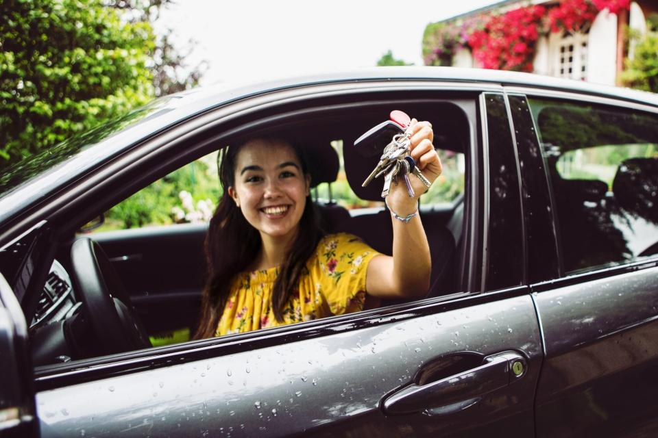 An image of a teen in a car.