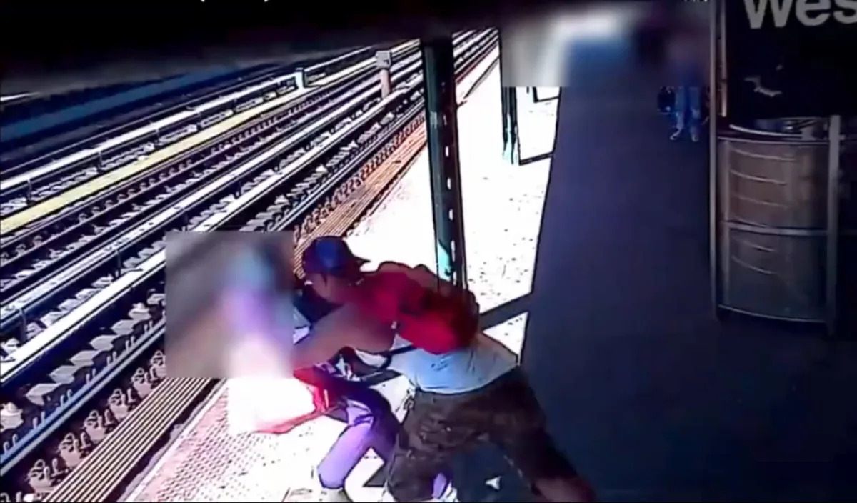 Terrifying video shows man throwing woman onto New York City subway tracks