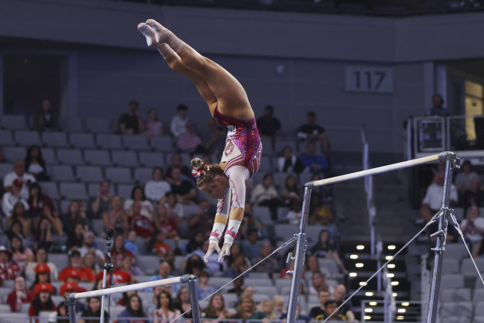 Oklahoma's Ragan Smith competes on the uneven bars during the NCAA college women's gymnastics championships, Saturday, April 16, 2022, in Fort Worth, Texas. (AP Photo/Gareth Patterson)