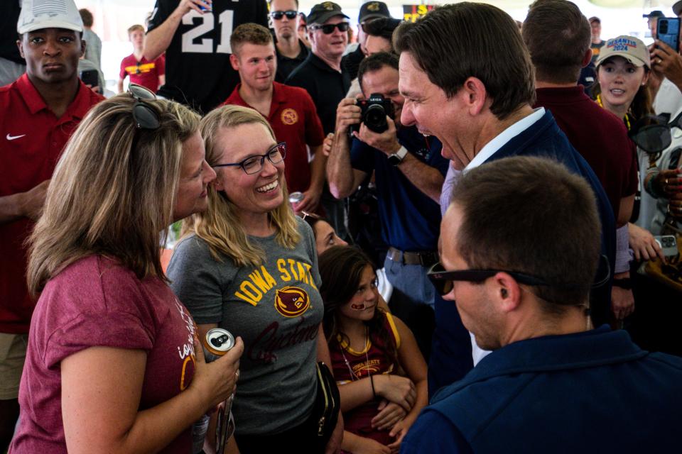 Florida Gov. Ron DeSantis talks with supporters at an Iowa State Wrestling tailgate before the Cy-Hawk football game at Jack Trice Stadium on Saturday, September 9, 2023 in Ames.