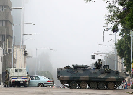 FILE PHOTO: Military vehicles and soldiers patrol the streets in Harare, Zimbabwe, November 15, 2017. Picture taken November 15, 2017. REUTERS/Philimon Bulawayo/File Photo