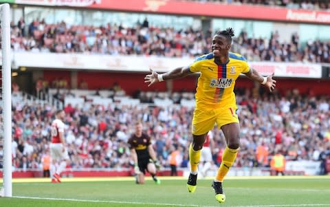 Wilfried Zaha puts Crystal Palace in front minutes after an Arsenal equaliser - Credit: getty images