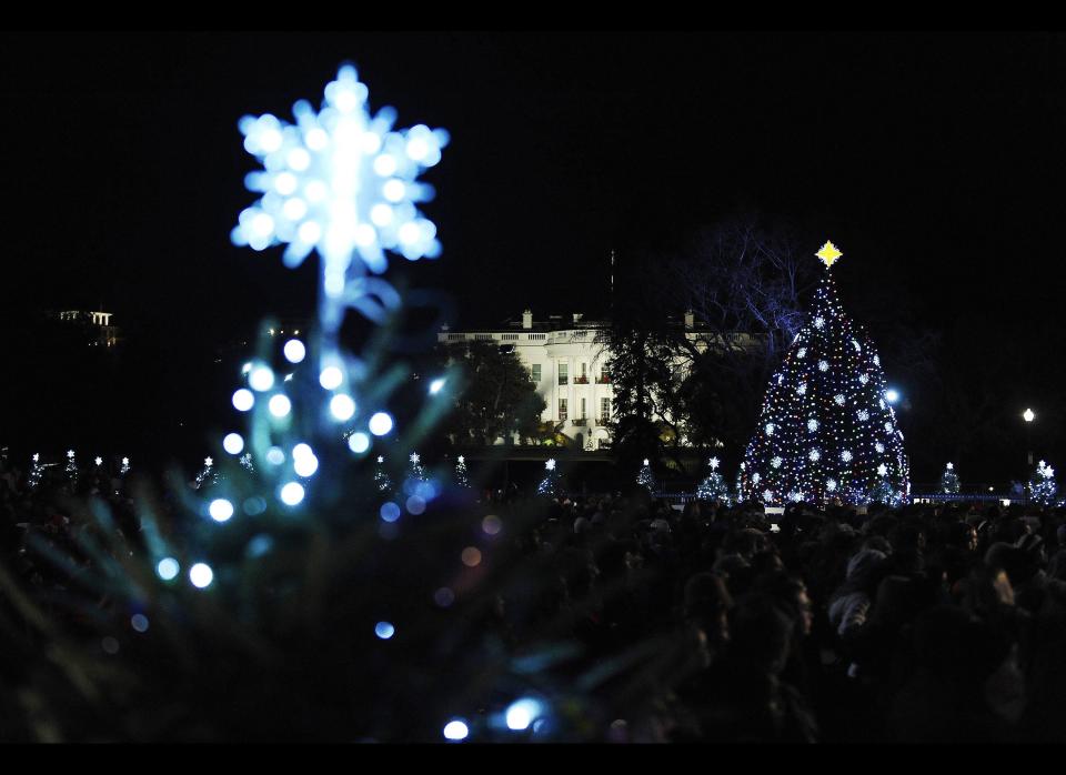 The 2011 National Christmas Tree is lit by U.S. President Barack Obama and the First Family during a ceremony on The Ellipse near the White House in Washington, D.C., on December 1, 2011. (JEWEL SAMAD/AFP/Getty Images)  