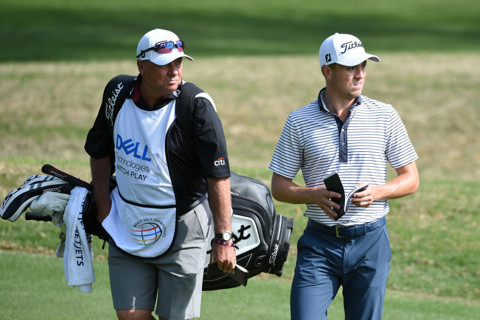 Justin Thomas and his caddy walk along at the WGC Match Play