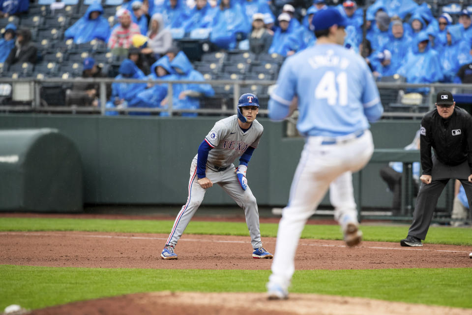 Texas Rangers outfielder Evan Carter leads off of first base during the fifth inning of a baseball game against the Kansas City Royals, Sunday, May 5, 2024, in Kansas City, Mo. (AP Photo/Nick Tre. Smith)