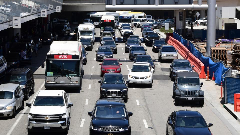 Heavy traffic is seen at Los Angeles International Airport (LAX) on May 27, 2021 in Los Angeles, as people travel for Memorial Day weekend, which marks the unofficial start of the summer travel season. - Global air passenger numbers could rebound from the coronavirus pandemic to top 2019 levels by 2023, the International Air Transport Association predicted on May 26. (Photo by Frederic J. BROWN / AFP) (Photo by FREDERIC J. BROWN/AFP via Getty Images)