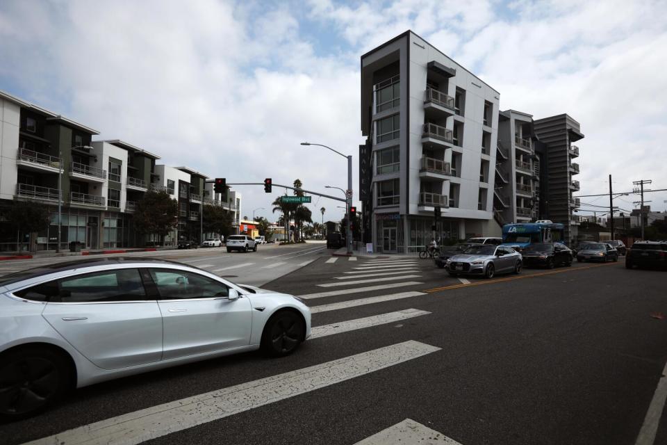 A Tesla passes in front of the Haven apartment complex in Culver City