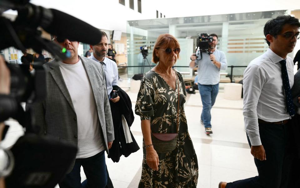 Gisèle Pélicot (centre) arrives at the courthouse during the trial of her husband who has been accused of drug possession for almost ten years