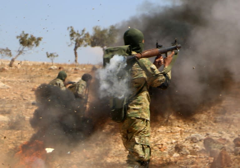 Syrian rebel fighters take part in combat training in the northern countryside of Idlib province on September 11, 2018