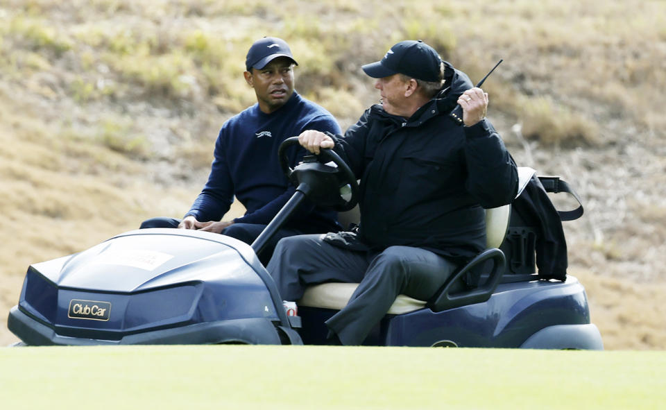 Tiger Woods, pictured here being driven off the course.